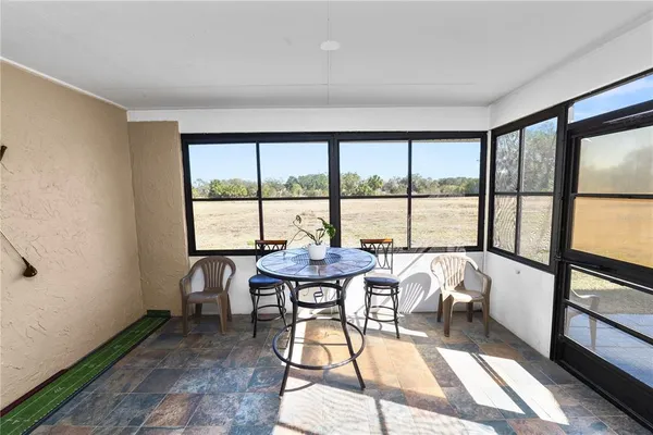 a view of a livingroom with furniture and window