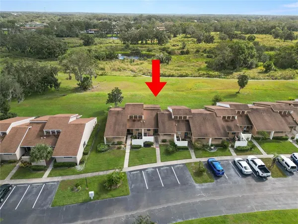 an aerial view of a house with a garden