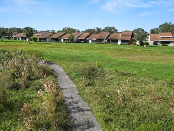 a view of house with outdoor space and street view