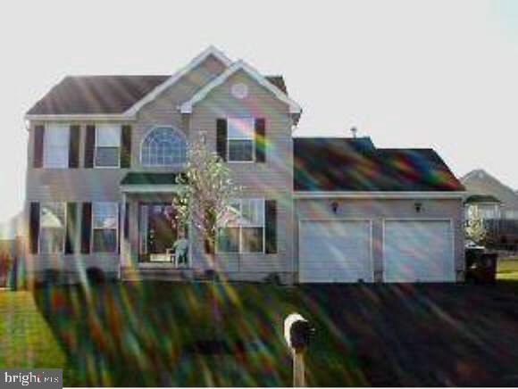 148 Barracuda Road Manahawkin, NJ 08050 - Photo 1 of 8 a front view of a house with a yard