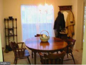 148 Barracuda Road Manahawkin, NJ 08050 - Photo 3 of 8 a view of a dining room with furniture and wooden floor