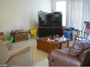 148 Barracuda Road Manahawkin, NJ 08050 - Photo 4 of 8 a living room with furniture and a fireplace