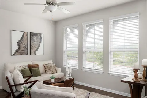a living room with furniture and windows