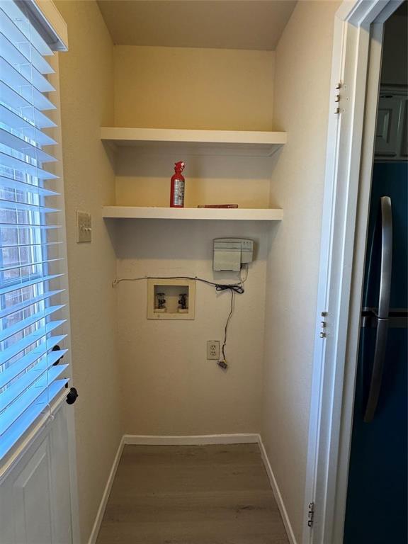 528 Post Oak Lane Allen, TX 75002 - Photo 17 of 19 a view of storage and utility room with racks on the wall