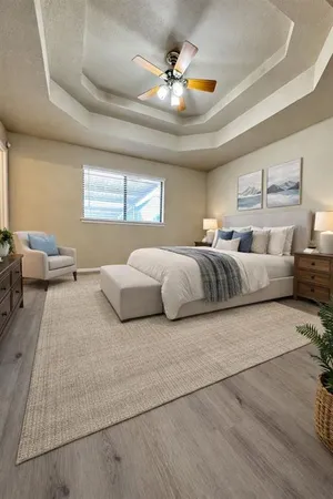 a spacious bedroom with a bed and window