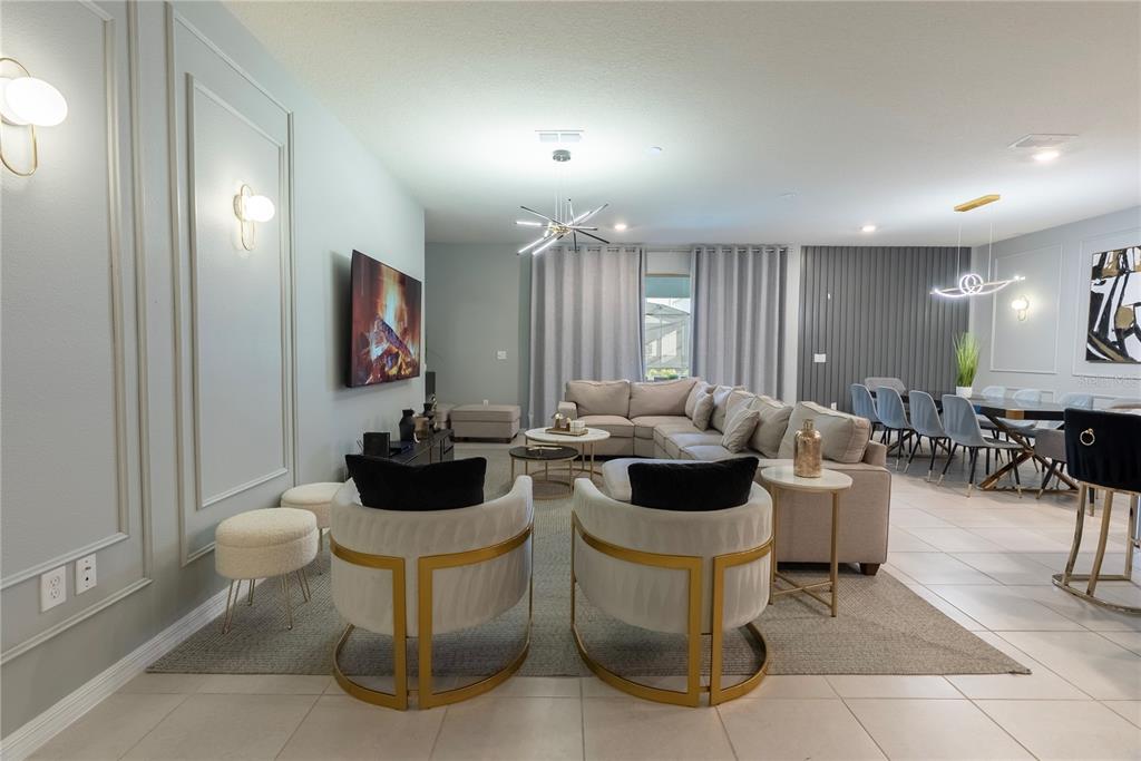 4425 Kaipo Road Davenport, FL 33897 - Photo 11 of 100 a living room with furniture and a large window