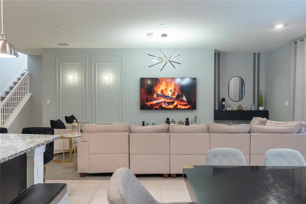 4425 Kaipo Road Davenport, FL 33897 - Photo 18 of 100 a living room with furniture and a flat screen tv