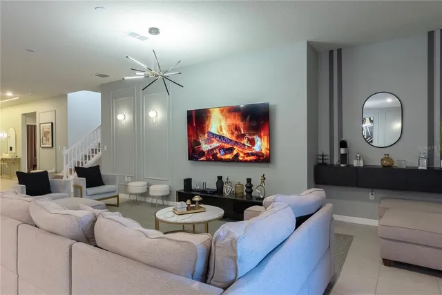 a spacious bathroom with a granite countertop sink a mirror a bathtub and shower