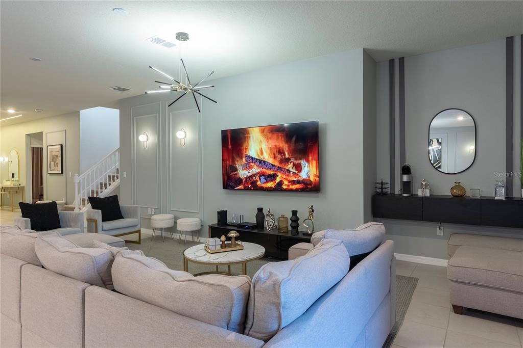 4425 Kaipo Road Davenport, FL 33897 - Photo 20 of 100 a living room with furniture and a flat screen tv