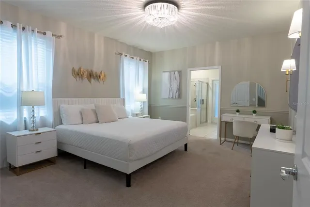 a bed room with a bed and a chair