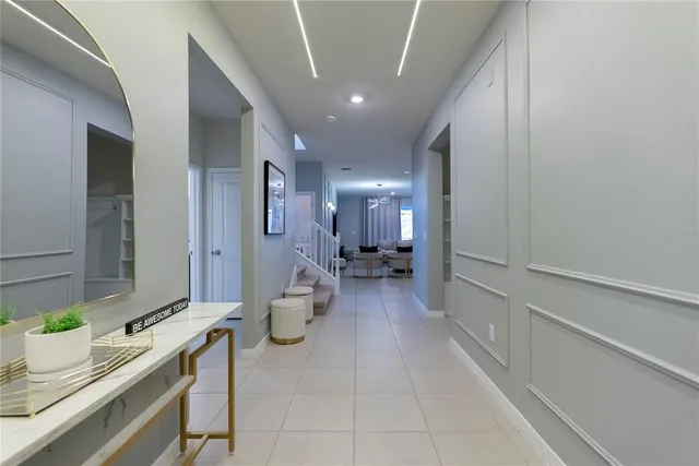 a bathroom with a granite countertop sink a toilet and a mirror