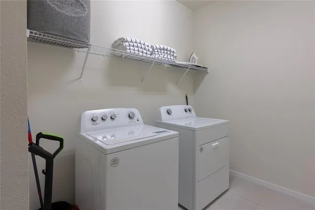 a view of a room with chairs and entryway