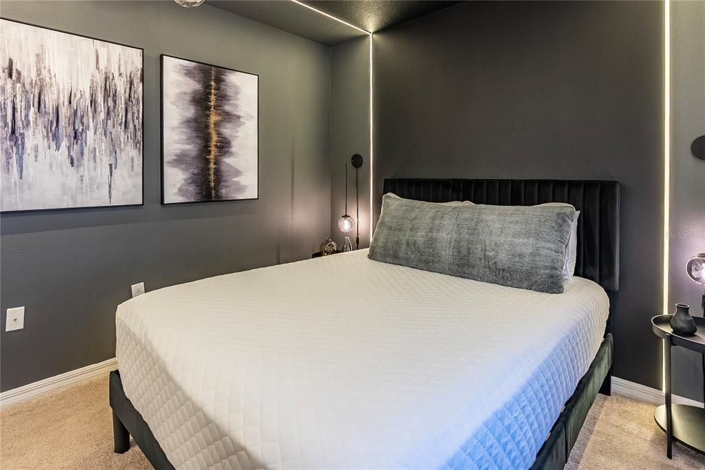 4425 Kaipo Road Davenport, FL 33897 - Photo 55 of 100 a bedroom with a bed and window