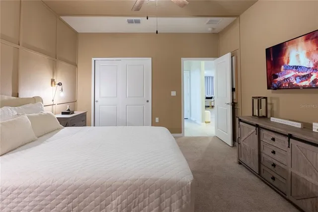 a bedroom with furniture and a wooden floor