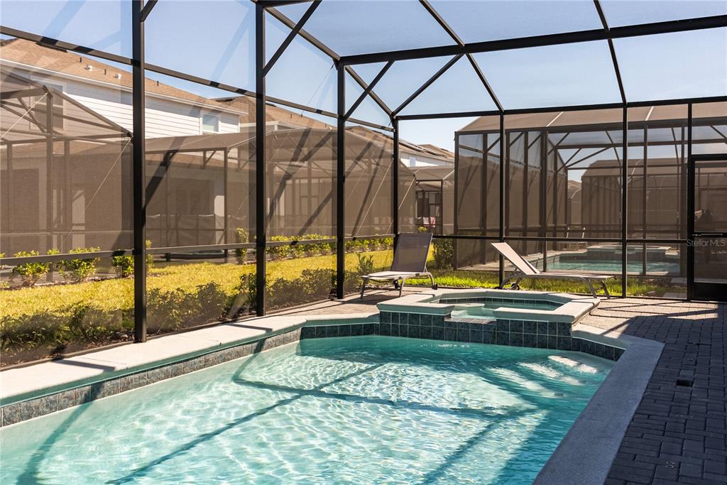 4425 Kaipo Road Davenport, FL 33897 - Photo 98 of 100 a view of swimming pool with outdoor seating