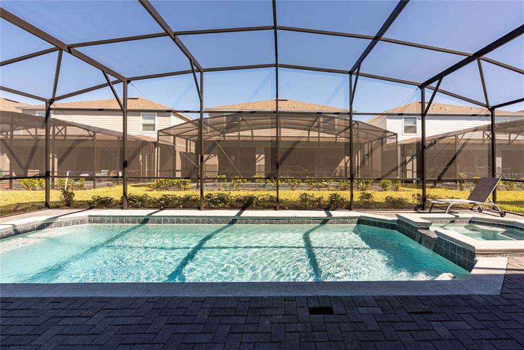 4425 Kaipo Road Davenport, FL 33897 - Photo 99 of 100 a view of a swimming pool with a patio