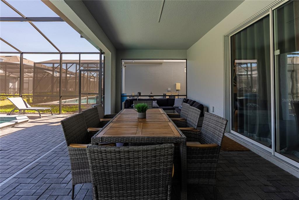 4425 Kaipo Road Davenport, FL 33897 - Photo 100 of 100 a dining room with furniture and wooden floor