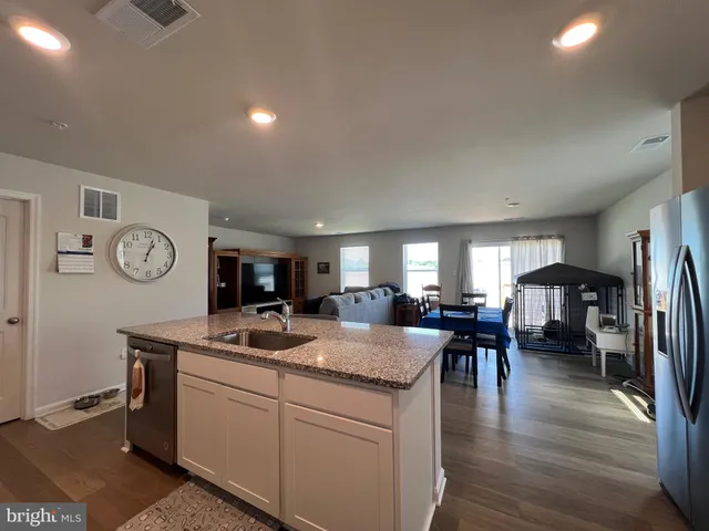 a kitchen with stove and refrigerator