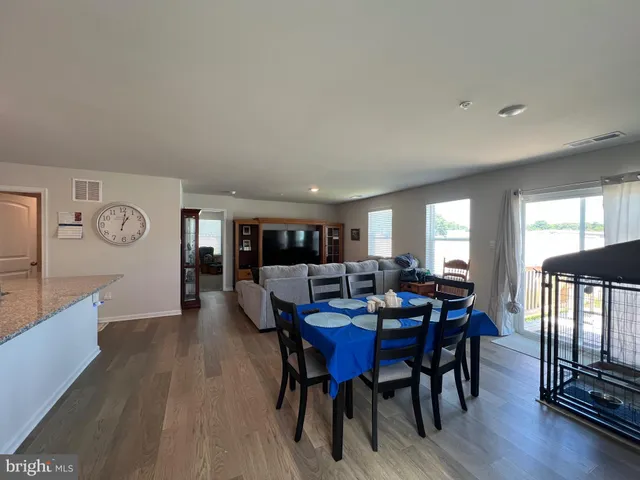 a view of a dining room with furniture and window