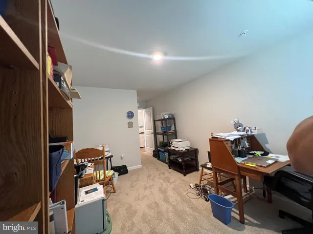 a view of a workspace with furniture