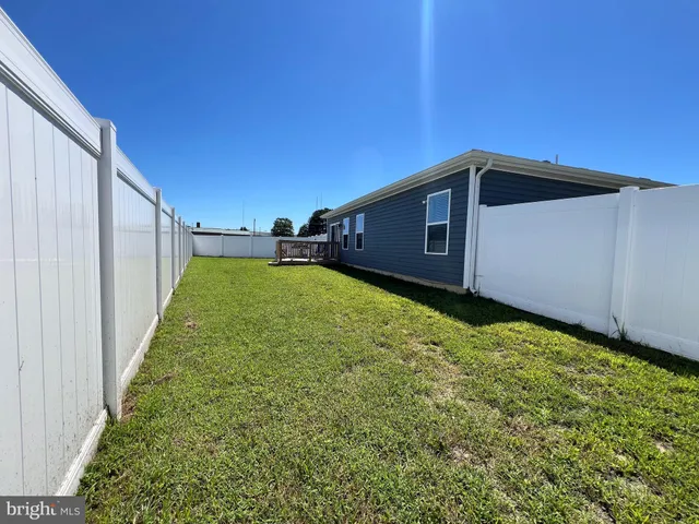 a view of a backyard with potted plants