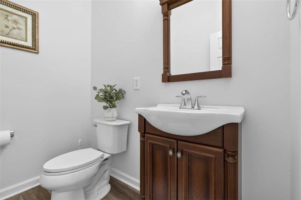3035 Mt Zion Road Oxford, GA 30054 - Photo 13 of 99 a bathroom with a sink toilet and a mirror