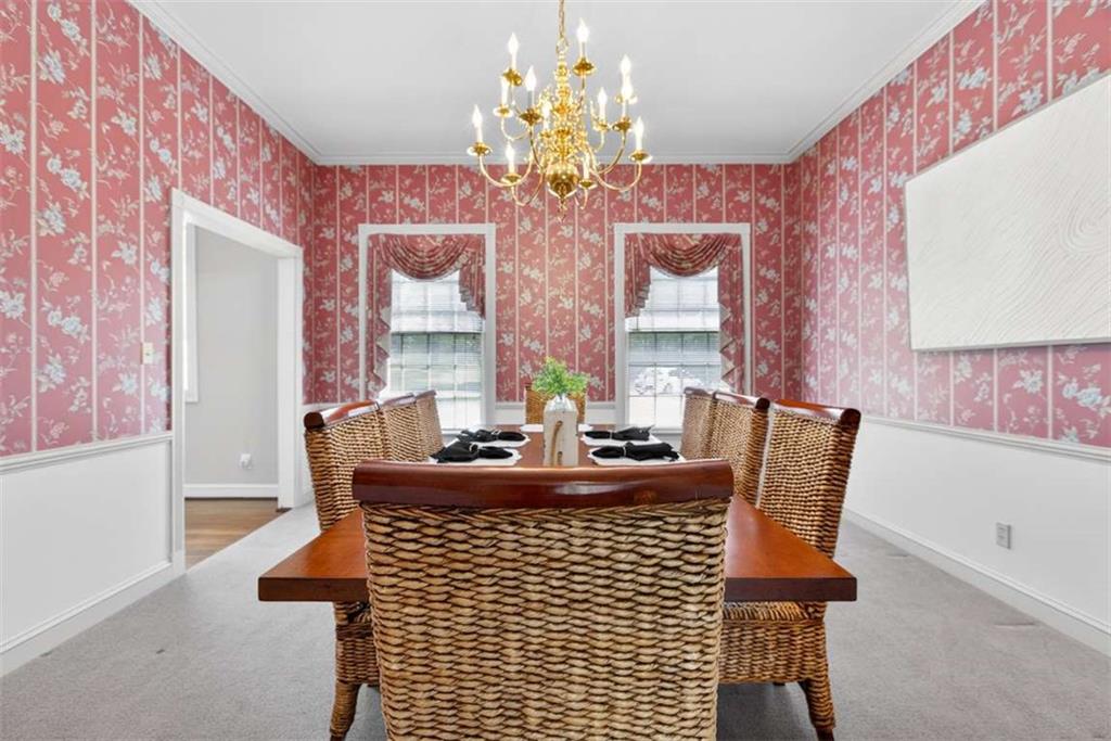3035 Mt Zion Road Oxford, GA 30054 - Photo 19 of 99 a view of a dining room with furniture and a chandelier