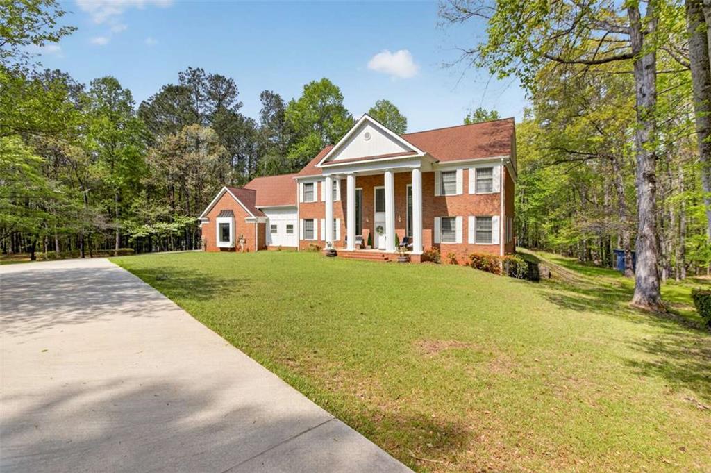 3035 Mt Zion Road Oxford, GA 30054 - Photo 2 of 99 a front view of a house with a yard