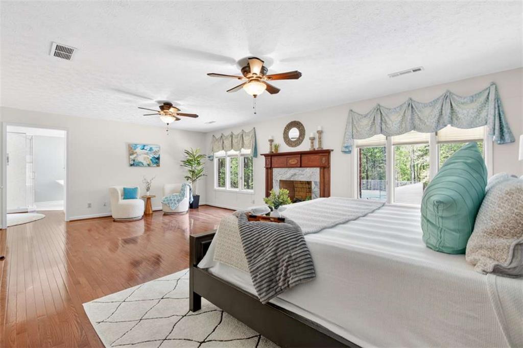 3035 Mt Zion Road Oxford, GA 30054 - Photo 51 of 99 a living room with fireplace furniture and a large window