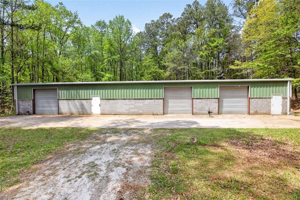 3035 Mt Zion Road Oxford, GA 30054 - Photo 83 of 99 a view of a backyard with a small cabin
