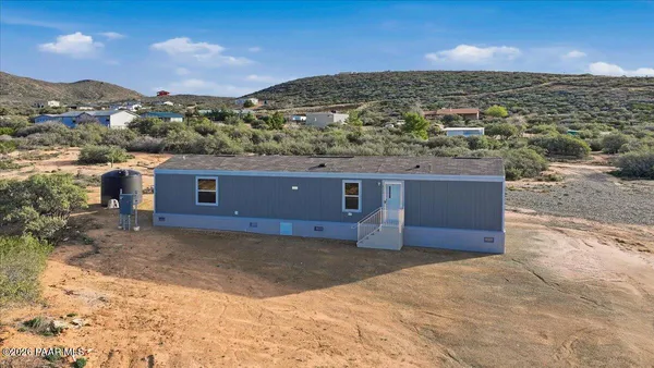 a view of a large building with a mountain in the background