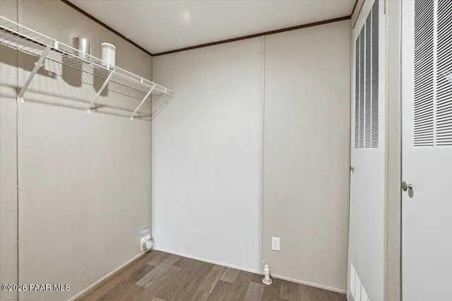 a view of a room with wooden floor