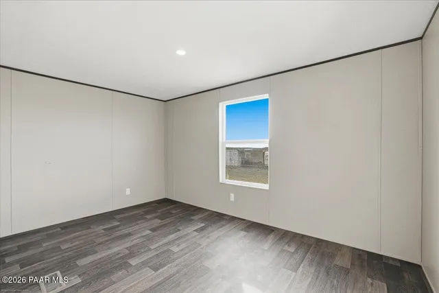 an empty room with a empty space and window