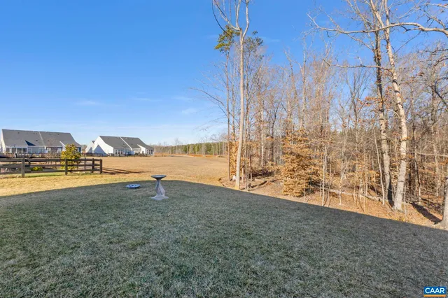 a backyard of apartments with large trees