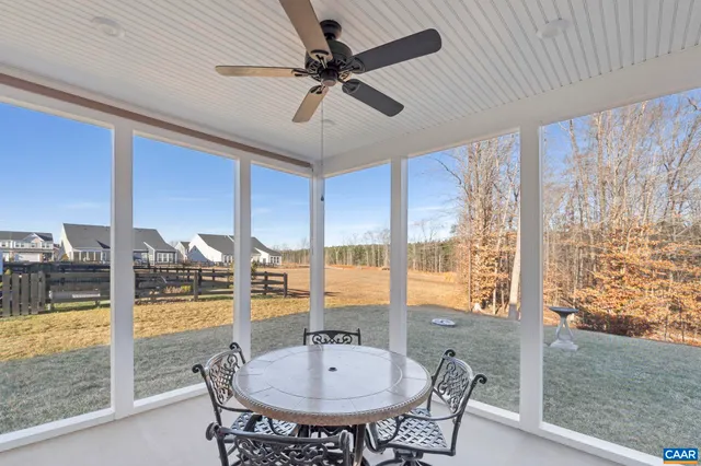 a kitchen with stainless steel appliances granite countertop a refrigerator a sink dishwasher a stove and a refrigerator with wooden floor