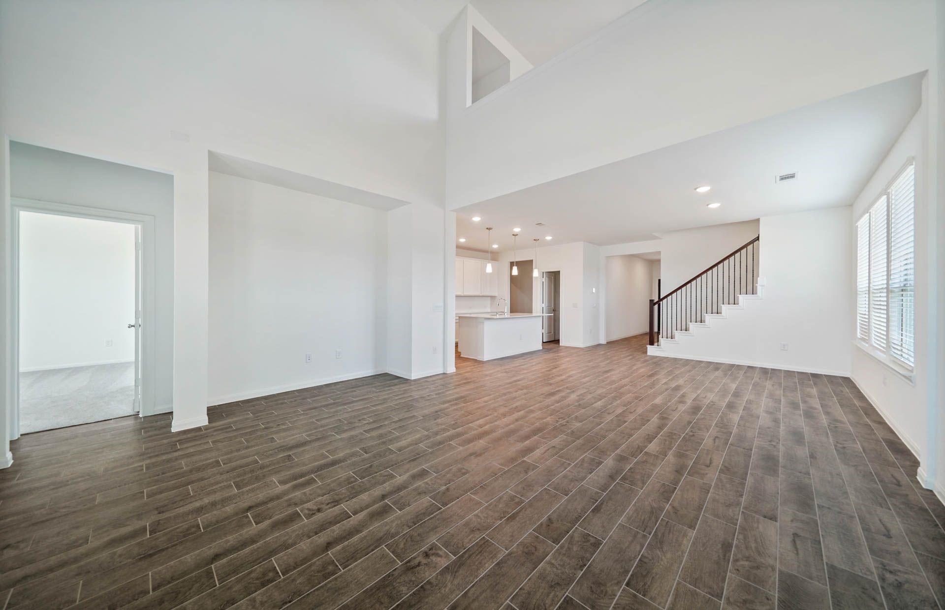 16193 Sepia Manor Street Conroe, TX 77302 - Photo 2 of 19 a view of empty room with wooden floor and window