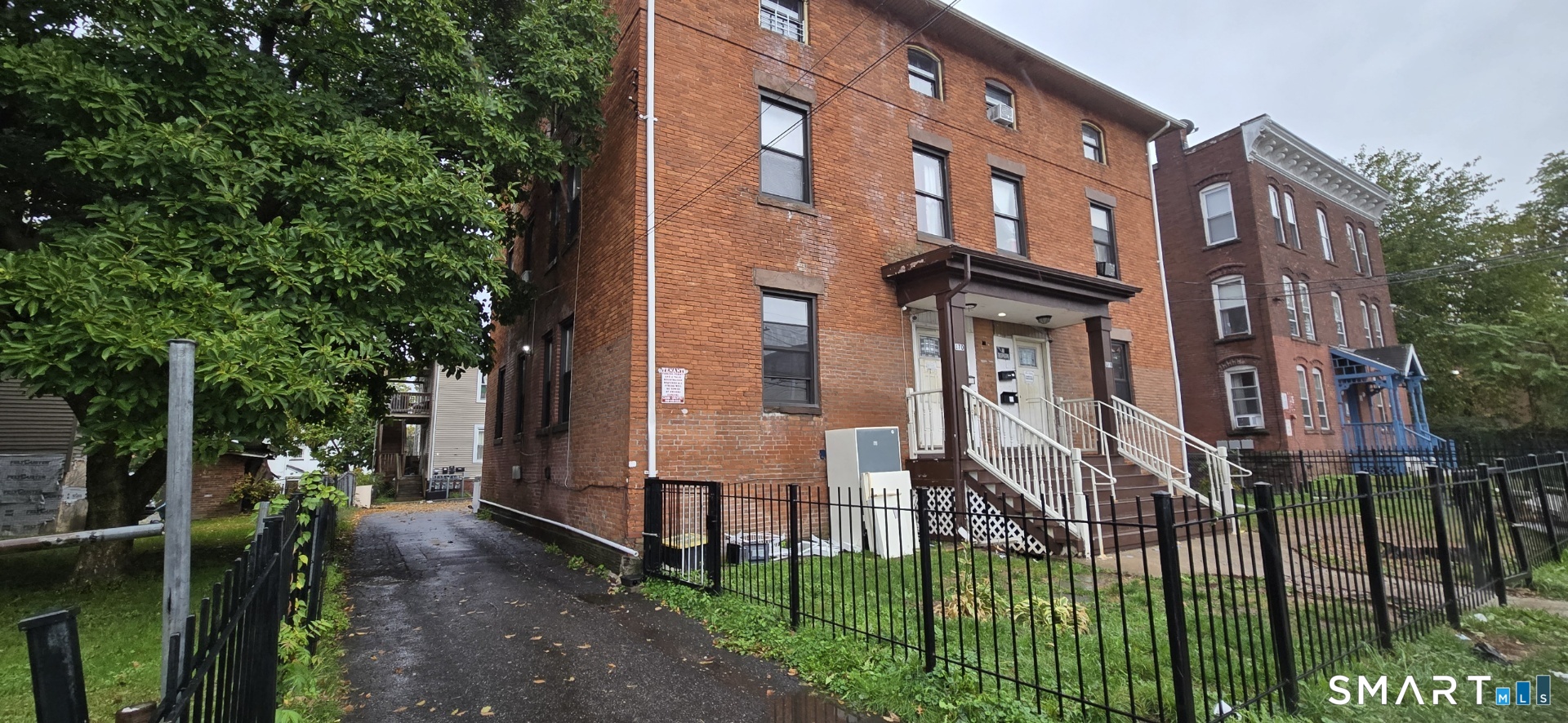 front view of a brick house with a large windows