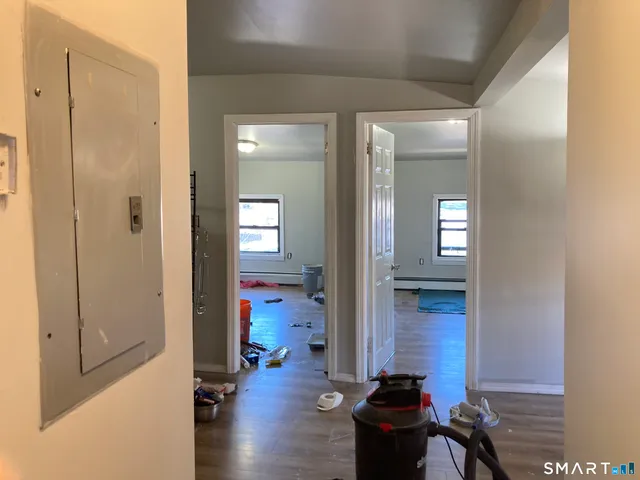 a room with furniture and a mirror