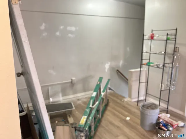 a kitchen with stainless steel appliances granite countertop a refrigerator stove and sink