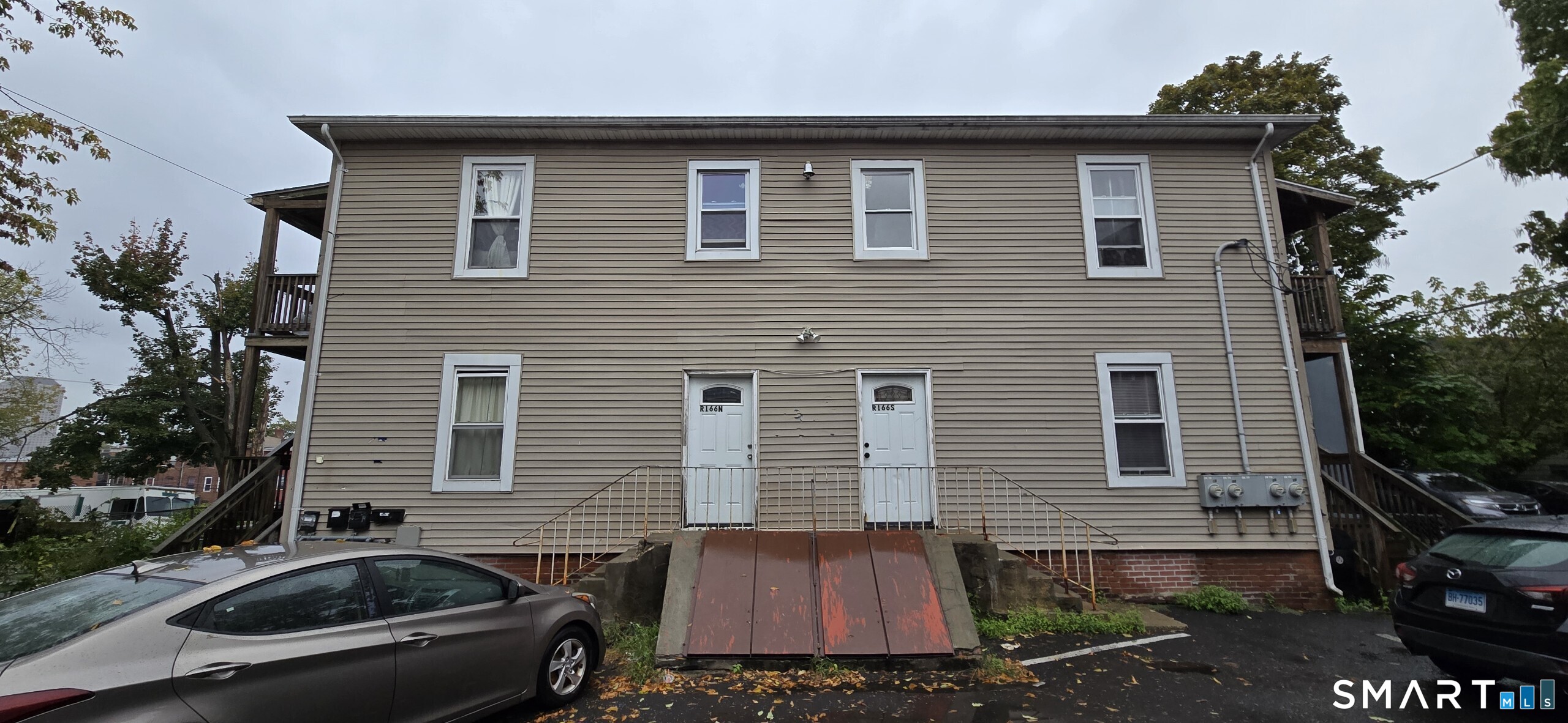 166 Affleck Street Hartford, CT 06106 - Photo 21 of 21 a view of a house with a yard and furniture