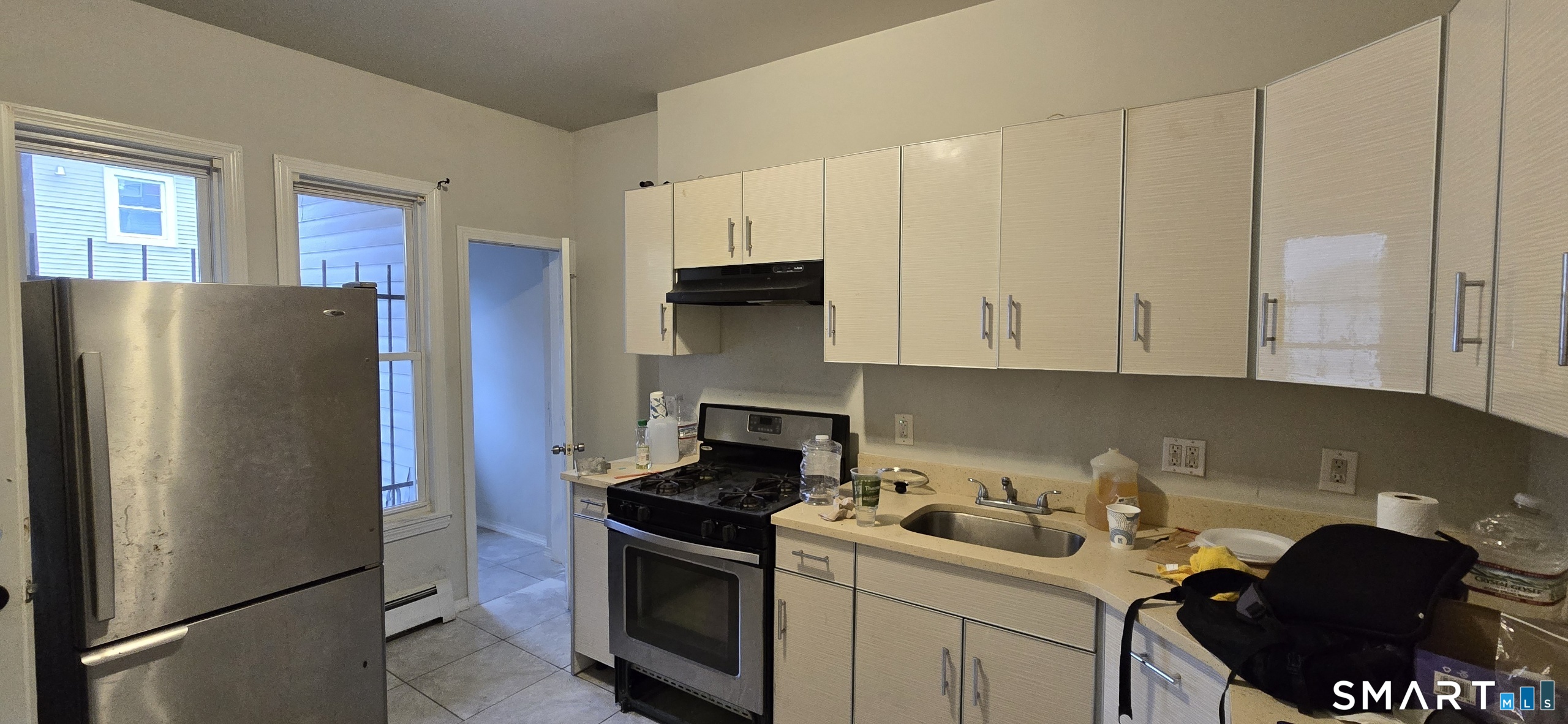 166 Affleck Street Hartford, CT 06106 - Photo 9 of 21 a kitchen with stainless steel appliances granite countertop a refrigerator stove and sink