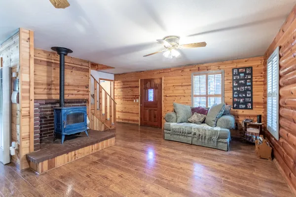a living room with furniture and a flat screen tv