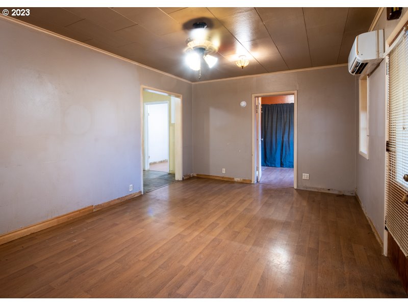 1225 E Street Springfield, OR 97477 - Photo 5 of 25 a view of an empty room and wooden floor