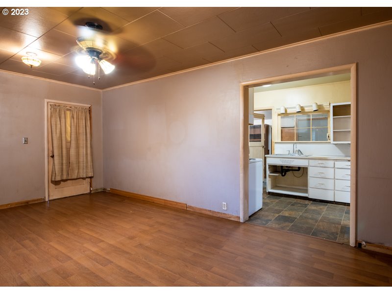 1225 E Street Springfield, OR 97477 - Photo 6 of 25 a view of an empty room with a kitchen