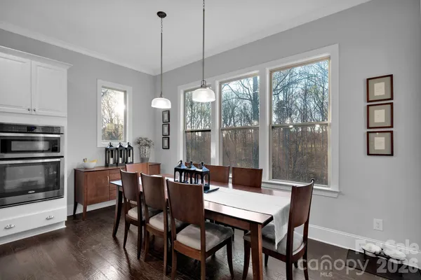 a view of a livingroom with furniture and a flat screen tv