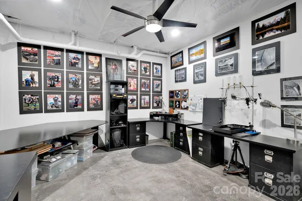 a bedroom with a bed and a bookshelf