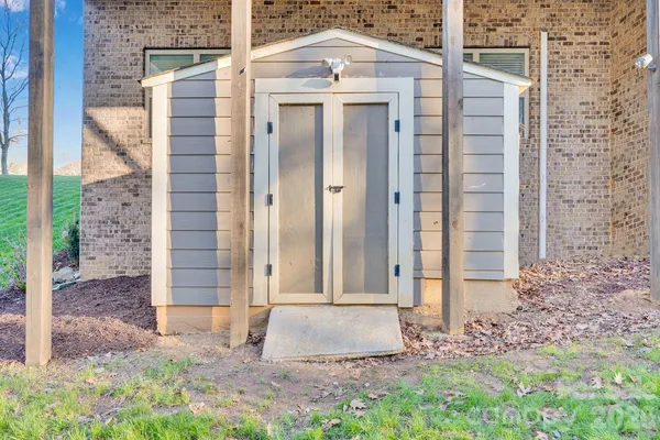an aerial view of a house with garden space and street view