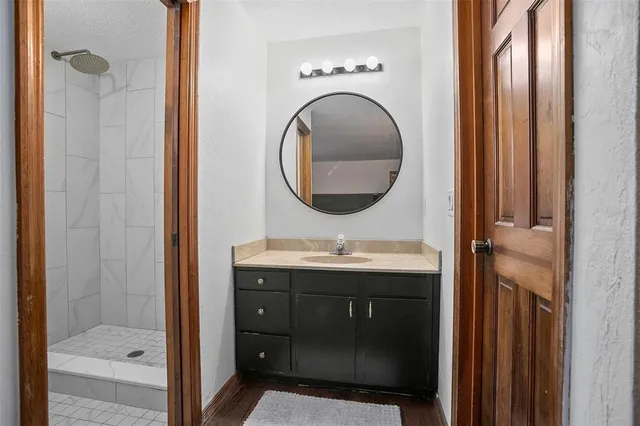 a bathroom with a sink and a mirror