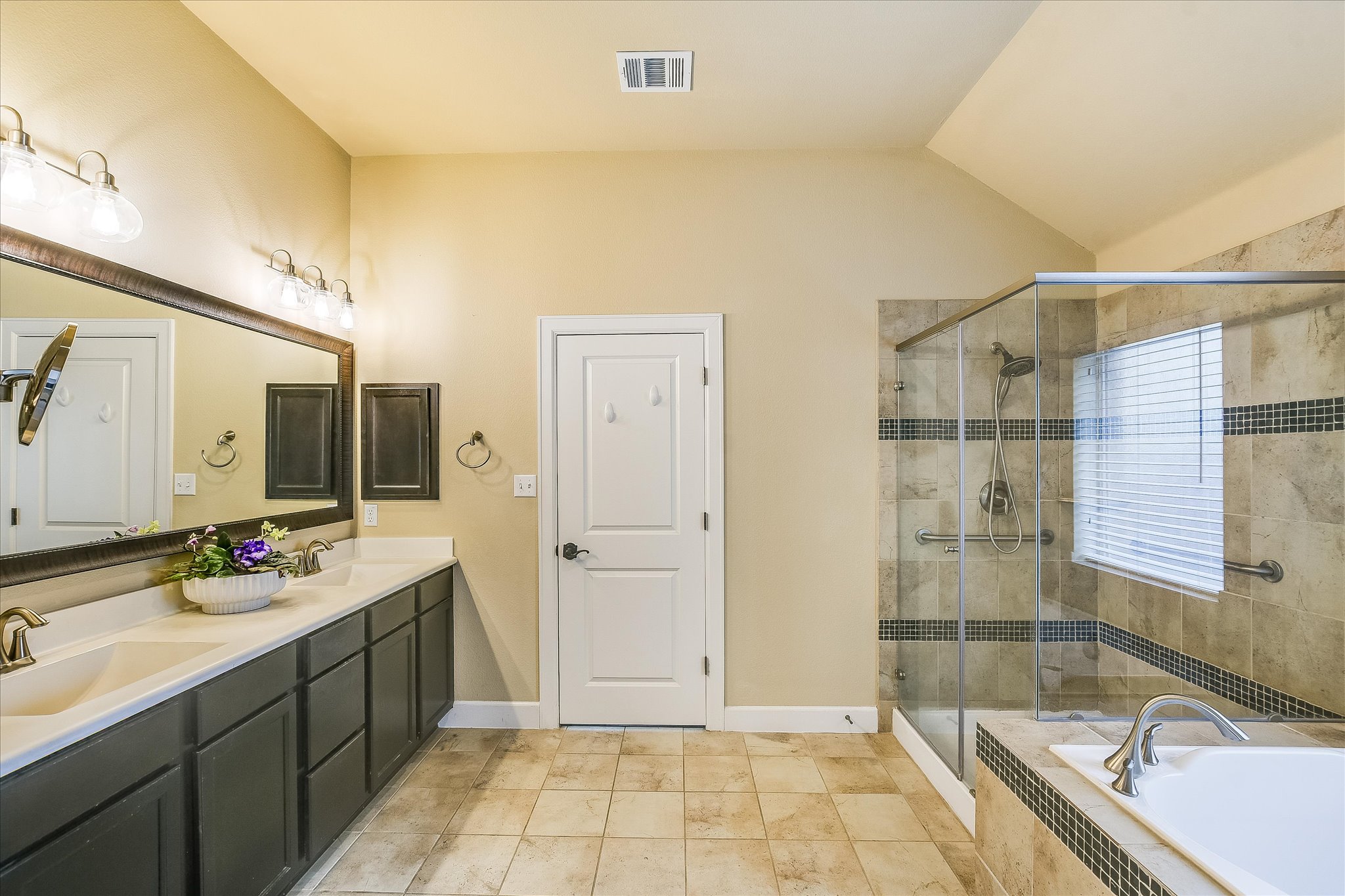 203 Gaspar Bend Cedar Park, TX 78613 - Photo 15 of 20 a bathroom with a tub sink and mirror