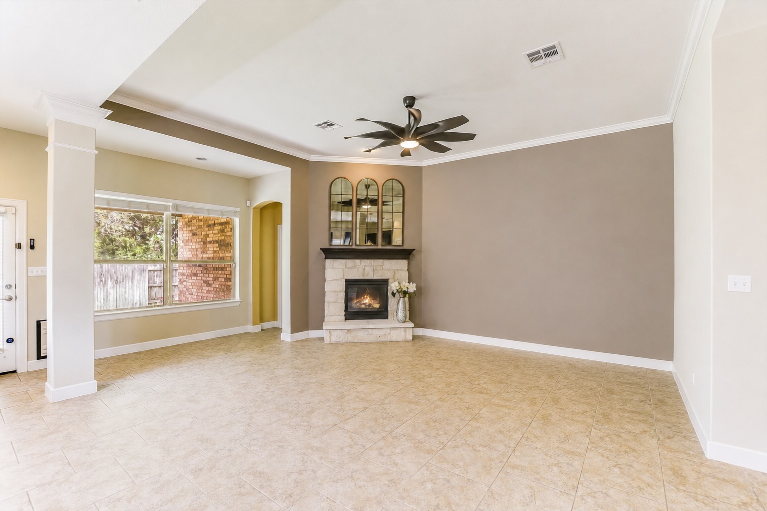 203 Gaspar Bend Cedar Park, TX 78613 - Photo 7 of 20 an empty room with windows and chandelier fan